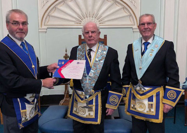 Pictured from left to right, are: Barry Fletcher presents the Patron Certificate to Tom Wood and Glyn Pine.