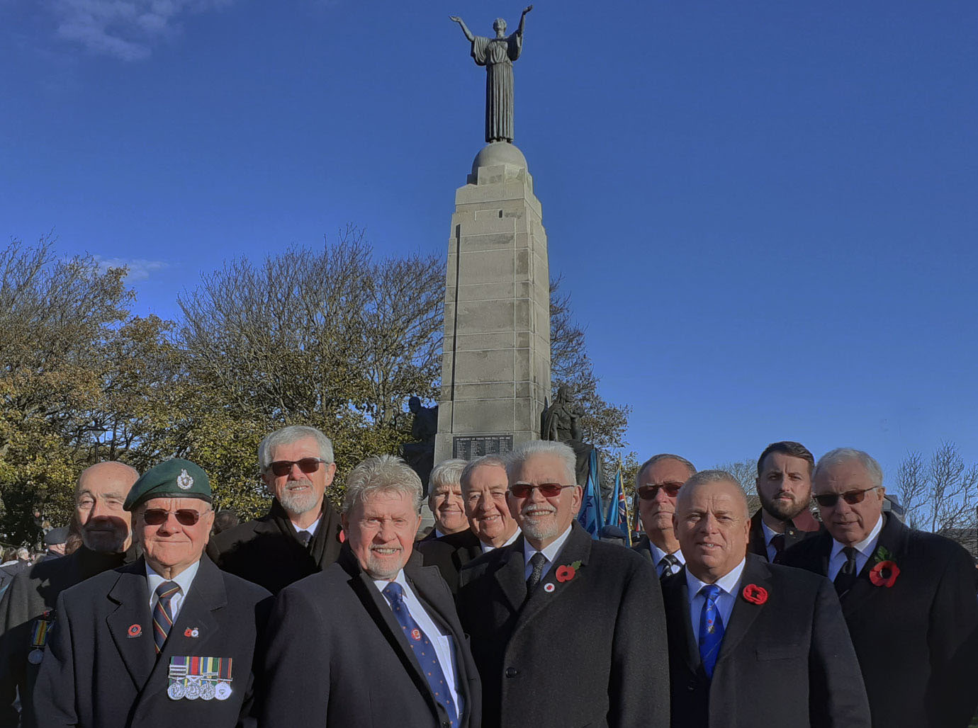 South Fylde Group Freemasons in front of the War Memorial following the laying of poppy wreaths