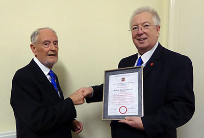 Ron Everard (left) receives his 50 years in the Royal Arch certificate from John Murphy.