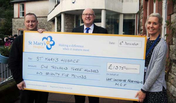 Pictured from left to right, are: Group charity steward Phil Renney, group chairman Gary Rogerson and Clare Paling, Area Fundraising Manager for the hospice.