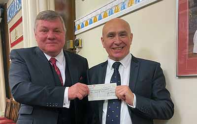 David Sampson for the Merseyside and Cheshire Blood Bikes (left) receives a cheque for £1,000 from Bob Martin. David Sampson for the Merseyside and Cheshire Blood Bikes (left) receives a cheque for £1,000 from Bob Martin.