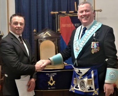 Juan Topping (right) welcomes Richie Puttock into the lodge. Juan Topping (right) welcomes Richie Puttock into the lodge.