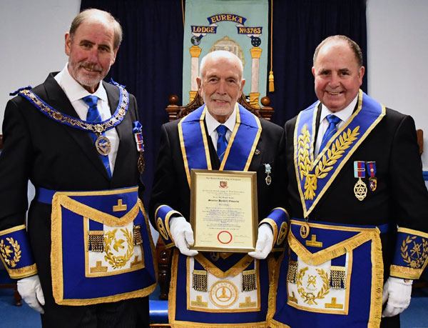 Pictured from left to right, are: Frank Umbers, Stan Edwards with his certificate and Graham Chambers.