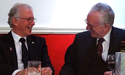 Bill McLoughlin (left) and Kevin Byrne share an amusing story at the dinner table.
