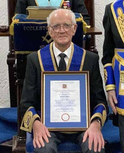 Michael Iddon with his well-deserved certificate of 50 Years membership.