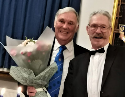 Roger Perry (left) receives flowers for his wife Hilary from Randal Boyd. Roger Perry (left) receives flowers for his wife Hilary from Randal Boyd.