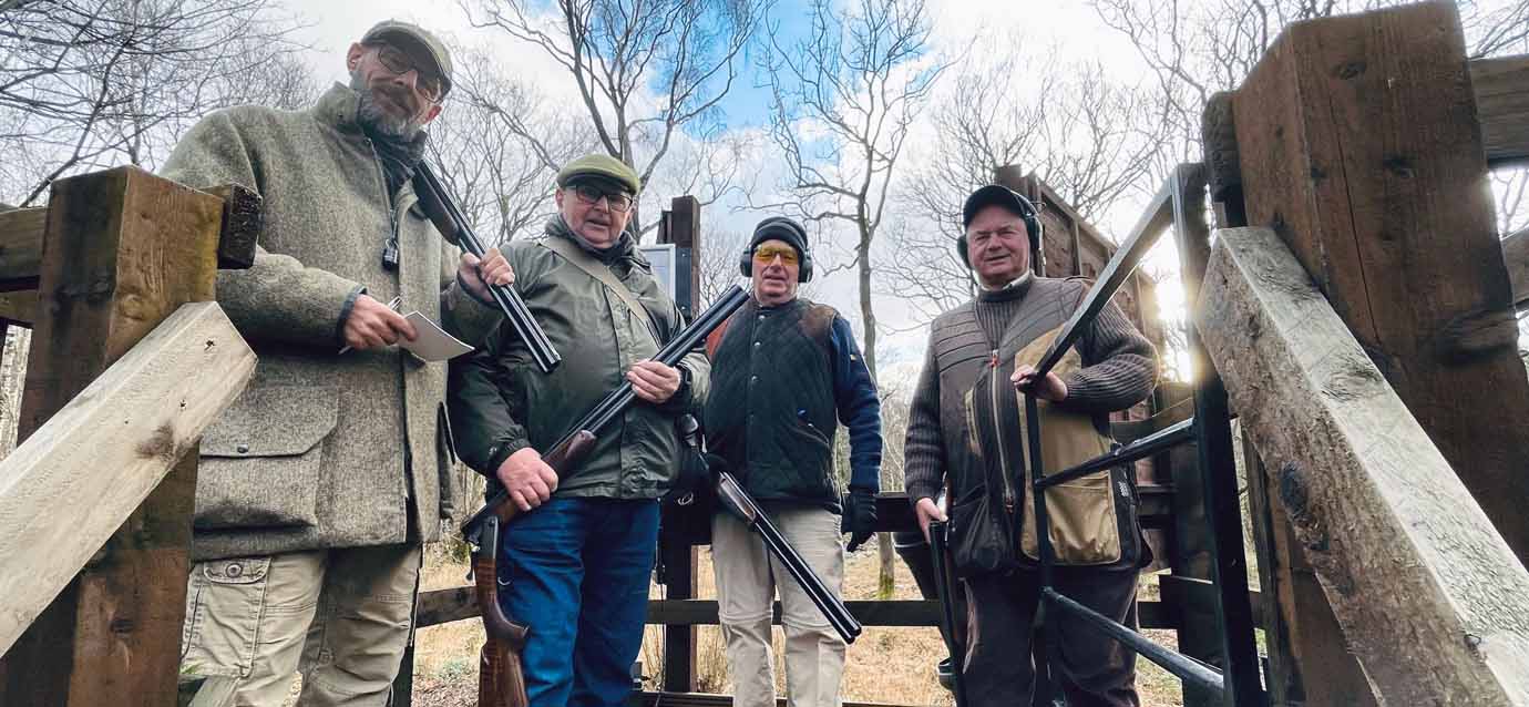 Shooters ready on a high-level trap. Shooters ready on a high-level trap.