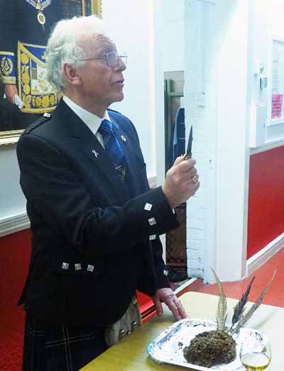 Bill McLaughlin addressing the haggis. Bill McLaughlin addressing the haggis.