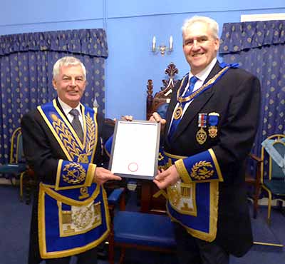 David (left) receives his 50-year certificate from Andrew Whittle.