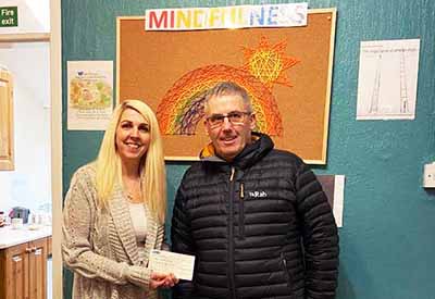 Stephen Corner presents the cheque to Jackie Moss. Stephen Corner presents the cheque to Jackie Moss.