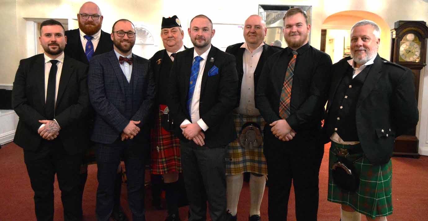 Paul Wharton-Hardman (centre) with those members and guests who wore traditional Scottish dress.