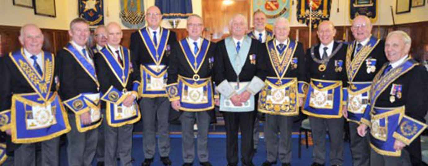 Grand and Provincial grand officers attending the Dalton-in-Furness Lodge installation with David Baker in the centre.