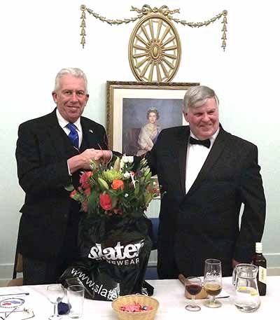Tom Kelly (right) presents Mark with a floral display for Debbie. Tom Kelly (right) presents Mark with a floral display for Debbie.
