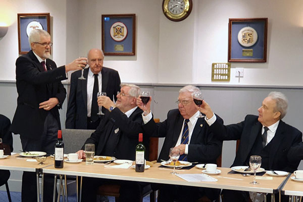 David Barr (left) toasts the three principals Brian Crawford, Rev Stephen Leach and Phil Coles.