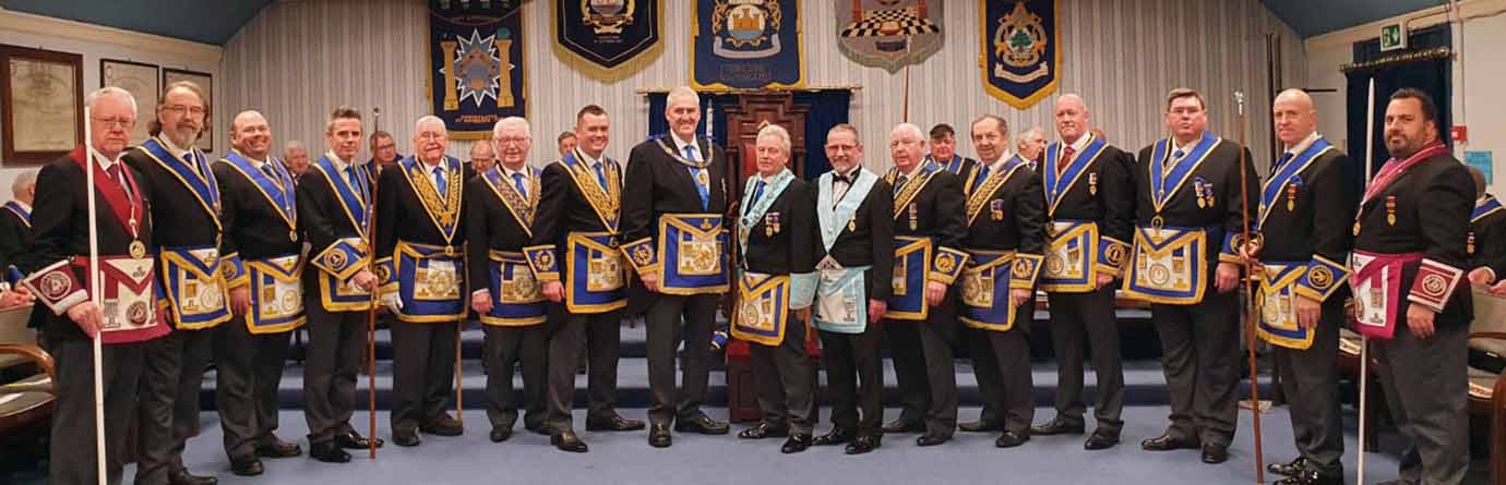 Andrew Whittle, Bob Bennett and Geoff Diggles surrounded by grand and acting Provincial grand officers. Andrew Whittle, Bob Bennett and Geoff Diggles surrounded by grand and acting Provincial grand officers.
