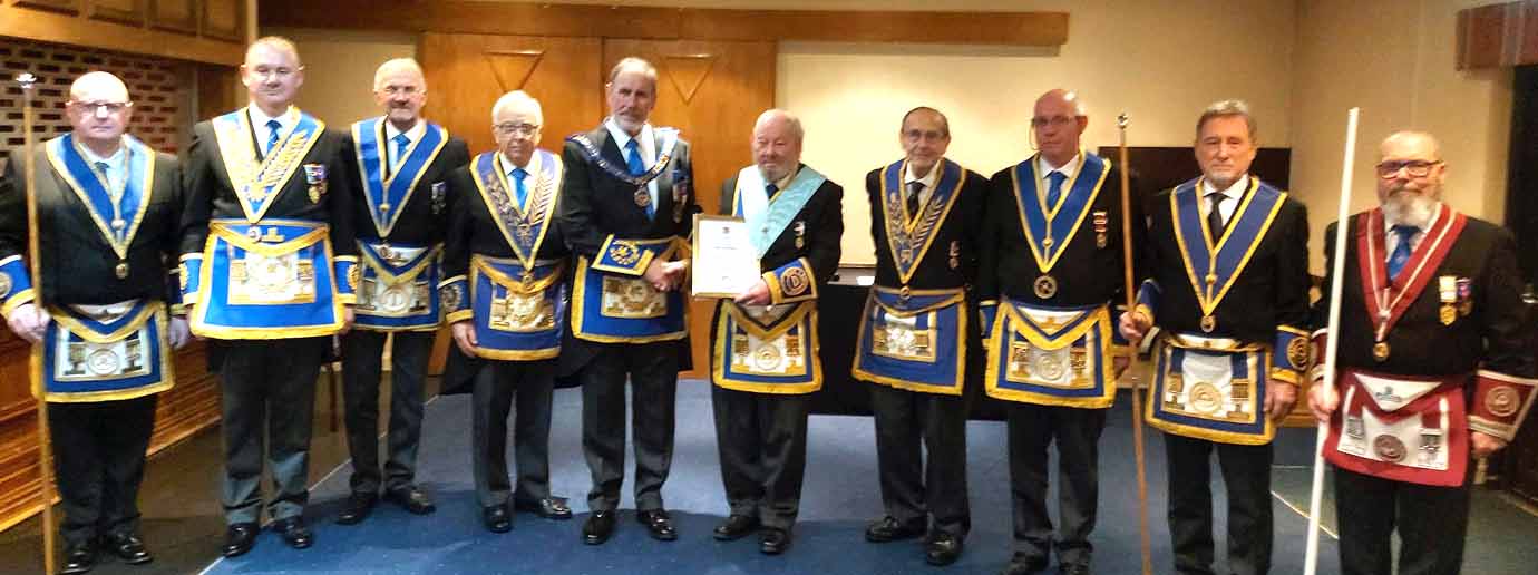 Frank Umbers and Dave Smith (centre) with the grand and acting Provincial grand officers. 
