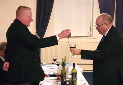Ray Thompson (right) toasts the master during the master’s song.
