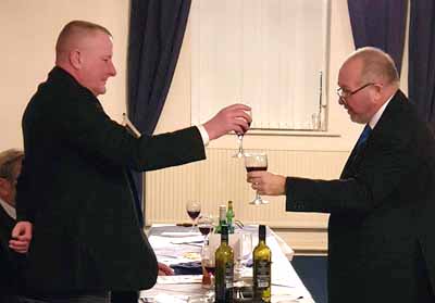 Ray Thompson (right) toasts the master during the master’s song. Ray Thompson (right) toasts the master during the master’s song.