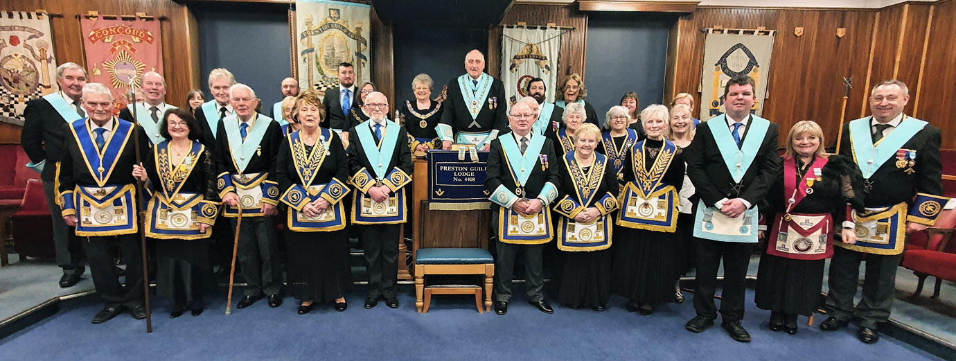 Ian Greenwood and Angela Seed are surrounded by the members of lodge No’s 4408 and 29.