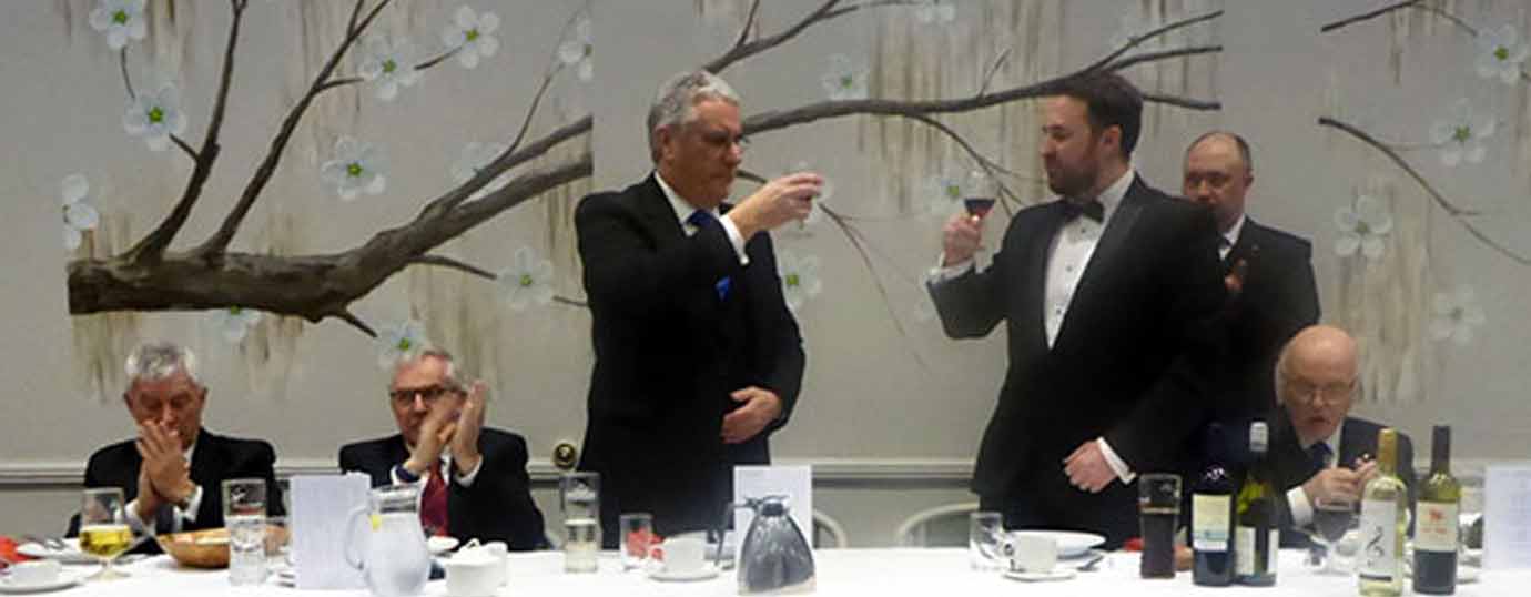 Andrew Barton (left) takes wine with Michael Daly.