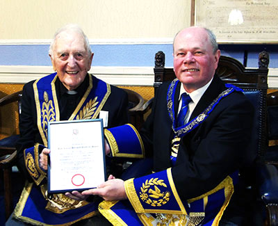 Duncan Smith (right) presents the certificate from the Provincial Grand Master to Geoffrey Moore. Duncan Smith (right) presents the certificate from the Provincial Grand Master to Geoffrey Moore.