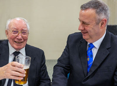 Norman and Peter share a laugh at the festive board.