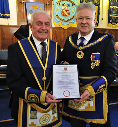 Peter Schofield (right) presents Bob Kett with his 50 years certificate.