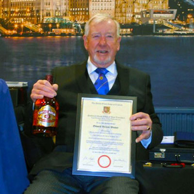 Ted Weaver with his certificate and gift from the lodge.