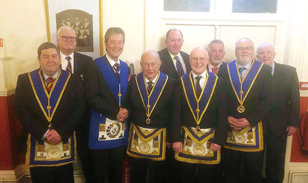 Christopher Collins (fourth left) is congratulated by the Provincial Grand Master of Shropshire Roger Pemberton, accompanied by brethren of Compass Lodge.