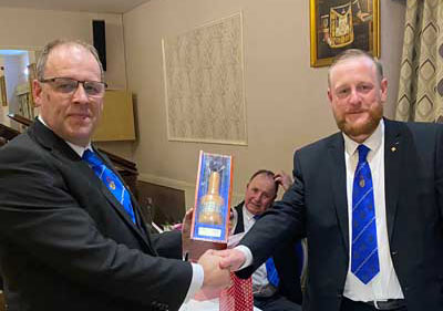 Martin (left) receives the gavel. Martin (left) receives the gavel.