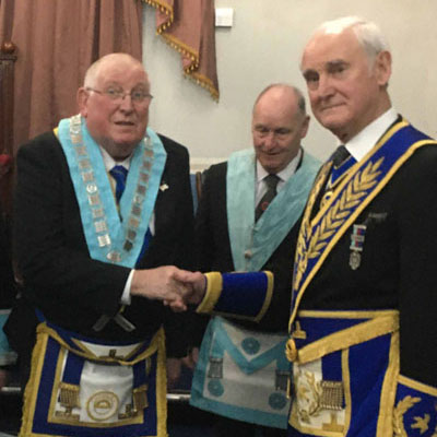 Stanley Oldfield (right) congratulates Rodney North. Stanley Oldfield (right) congratulates Rodney North.