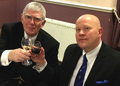Tony Harrison (left) toasts Malcolm Bell. Tony Harrison (left) toasts Malcolm Bell.