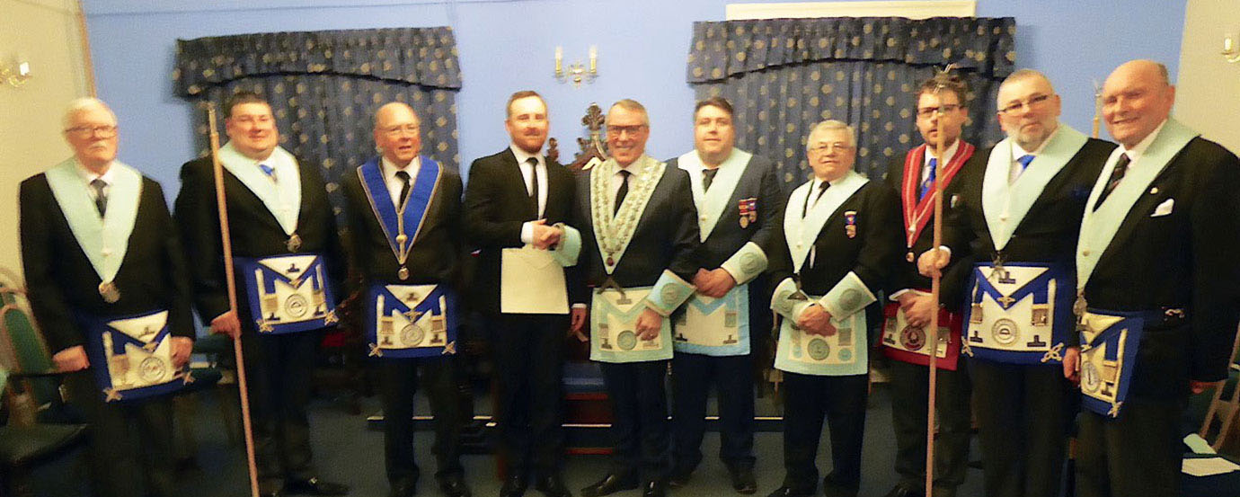 The ceremonial team welcomes Andrew to the lodge.