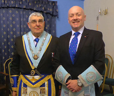 Fred Hulse (left) welcomes master elect Steven Baker. Fred Hulse (left) welcomes master elect Steven Baker.
