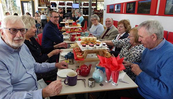 The party settles down to high tea. The party settles down to high tea.