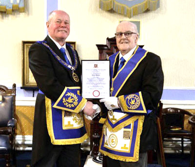 Duncan Smith (left) and Jim Harper with his 50 years in Freemasonry certificate.