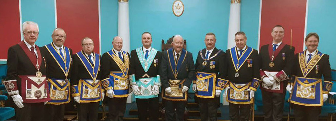 Winston (centre) with the WM Geoffrey Gorner, Peter Lockett and grand and acting Provincial grand officers.