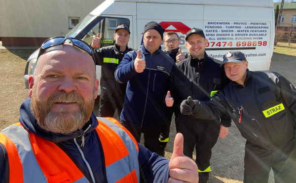 Jon with Polish firefighters helping with the care of Ukrainian refugees.