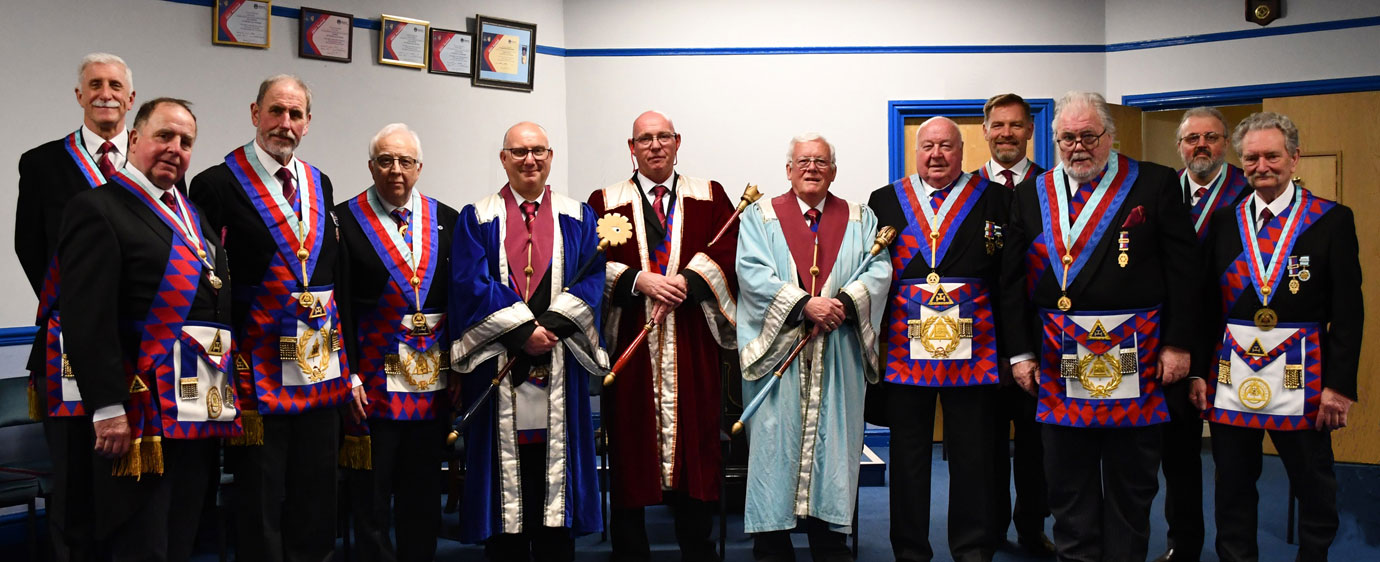 Pictured from left to right in the centre are: Malcolm Alexander, Andrew Oliver, Stephen Oliver and Len Hudson, with the grand and acting Provincial grand officers and Provincial grand officers.