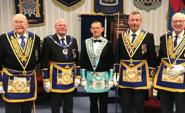 Pictured from left to right, are: Grand officers Jim Woods, Duncan Smith, Jason Dell and Peter Greathead with Jason Bleakley (centre).