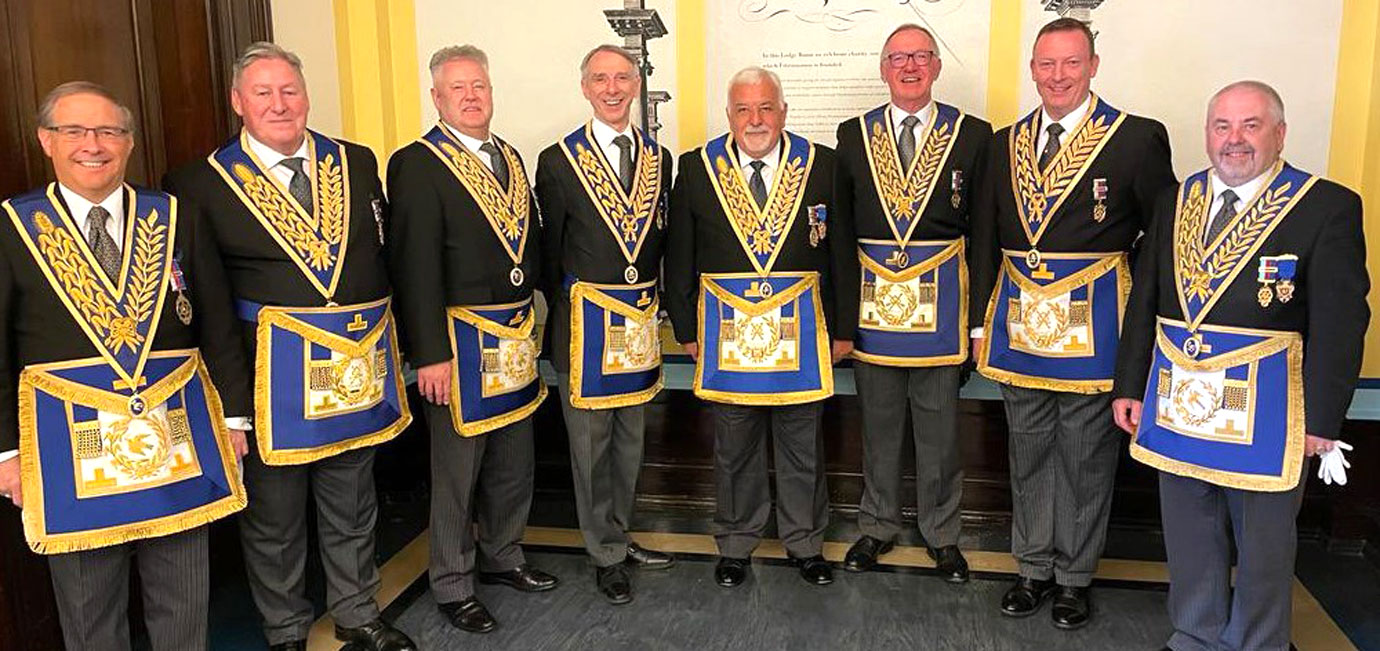West Lancs celebrants ready to be invested by the Grand Master. Pictured from left to right, are: Giles Barclay, Neil McGill, Peter Schofield, Graham Williams, Barry Dickinson, John Robbie Porter, Jason Dell and Chris Butterfield.