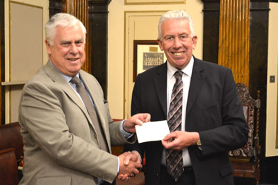 Dave Johnson (left) receiving cheque on behalf of ‘Smiley Faces’ from Mark Matthews. Dave Johnson (left) receiving cheque on behalf of ‘Smiley Faces’ from Mark Matthews.