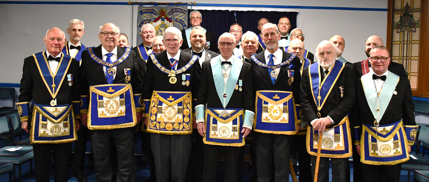 Members of Prince of Architects Lodge wearing their centenary jewels.