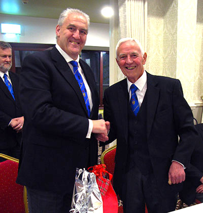 Andy Whittle (left) congratulates John Waring at the festive board.