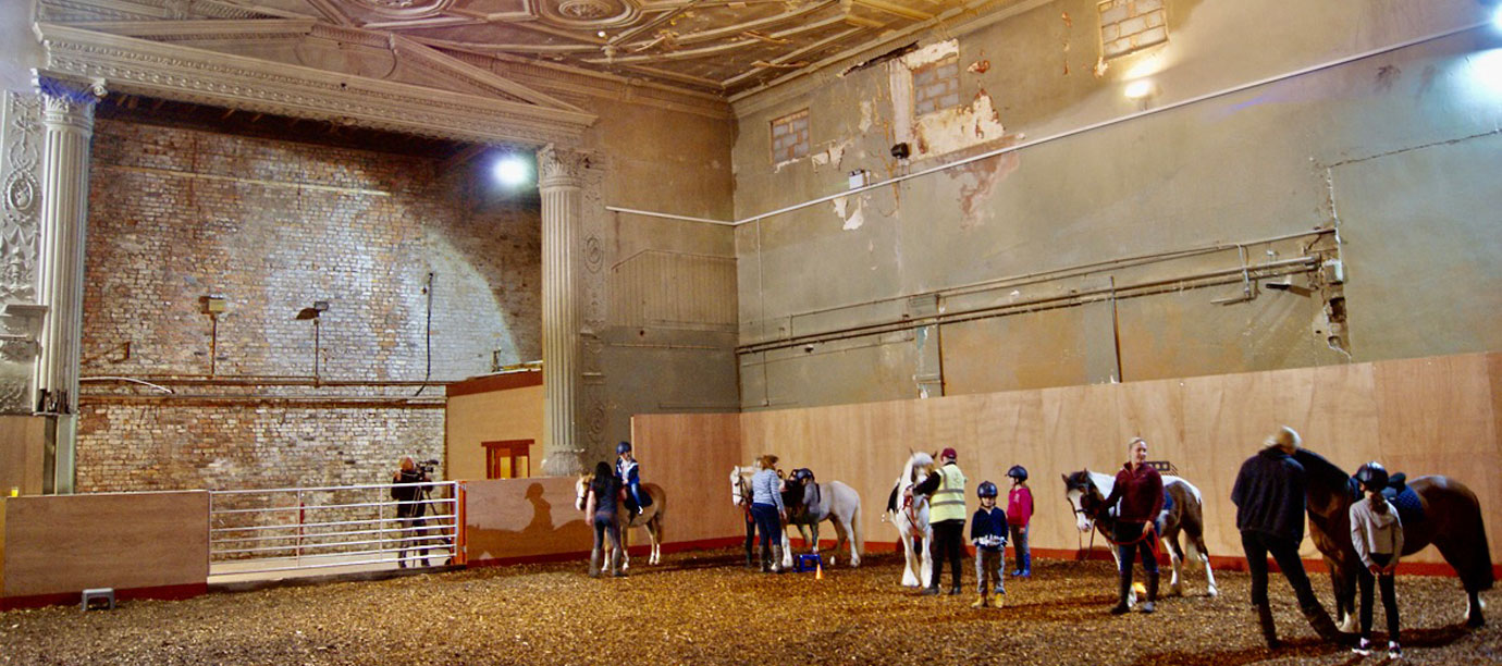 Inside the riding school of Park Palace Ponies.
