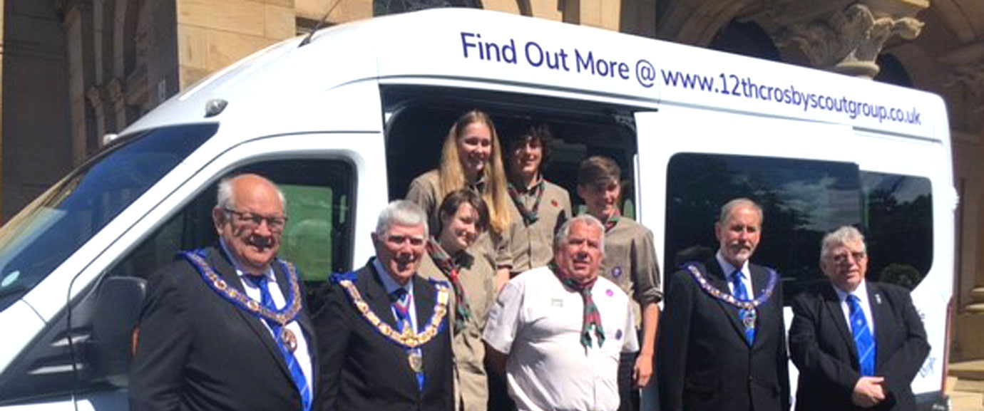 Pictured from left to right, are: Phil Gunning, Tony Harrison, Tim Hodgson, Frank Umbers and Alan Riley, with members of the scouts watching from their new minibus.