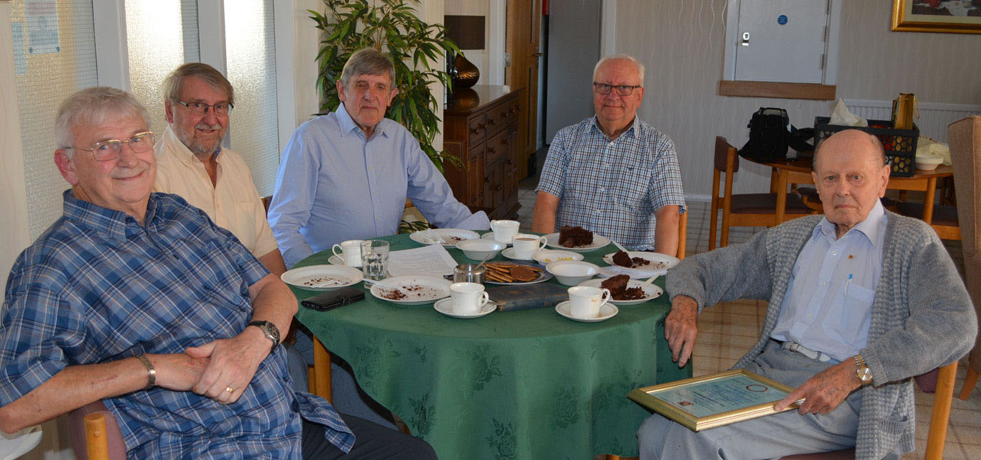The group enjoying tea and cake with Alan. 