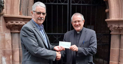 Revd Michael Ridley was delighted to receive the donation from Andy Barton. Revd Michael Ridley was delighted to receive the donation from Andy Barton.