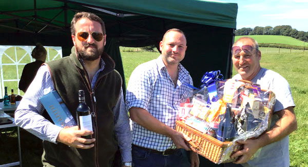 Pictured from left to right, are: David Jenkinson, Andy Finch winning the first prize hamper and Andy McClements.