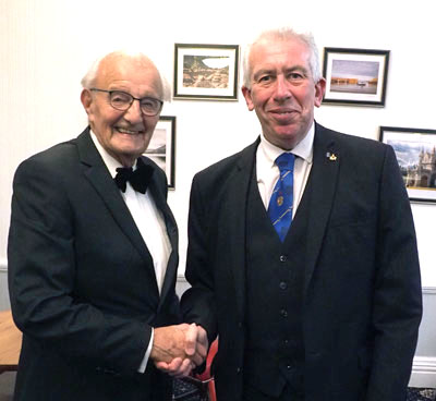 George Coulter (left) being congratulated on his promotion by Mark Matthews. George Coulter (left) being congratulated on his promotion by Mark Matthews.